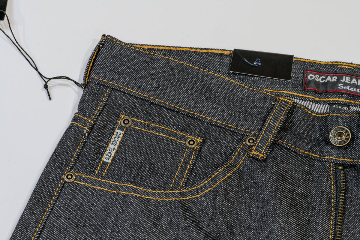 Front waistband and coin pocket with brass rivets